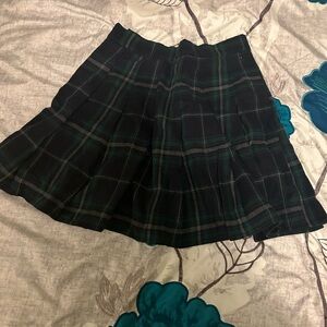 This is a small skirt pleated and tartan